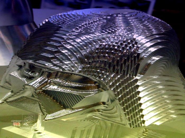 Many curves machined in Vader head bust by an N/C miller.
